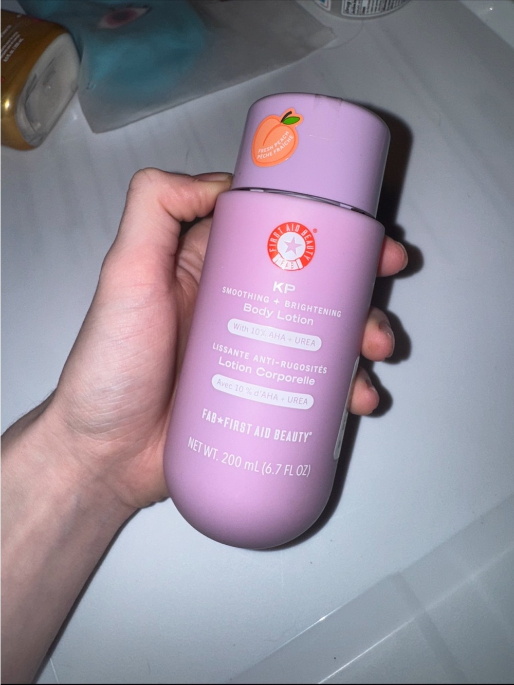 First Aid Beauty KP Smoothing + Brightening Body Lotion - Light Pink Bottle